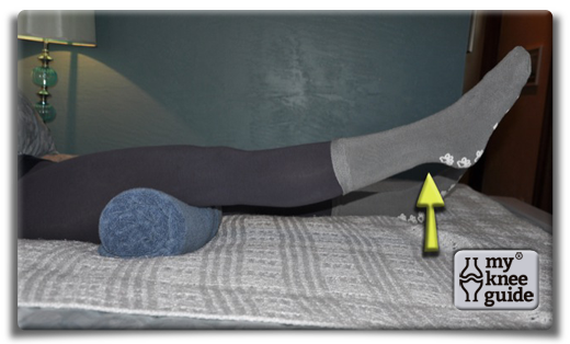 Lying Knee Extension - Move the towel to under your lower thigh. Straighten the knee and lift your foot off the bed